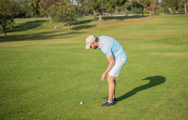 guy playing golf game on green grass, summer