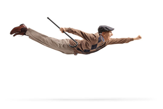Superhero elderly man holding a cane and flying