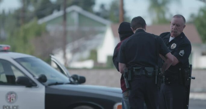Police Officer Holsters Gun After Suspect Cuffed, Walks Over To The Perp At, LAPD