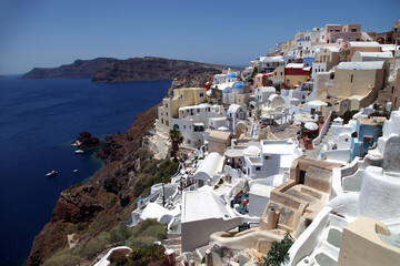 Fototapeta na wymiar Oia Town at beautiful Greek island Santorini in Greece. Oia is a small town and former community in the South Aegean on the Santorini.