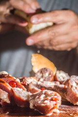 Sausage and peppers, artisan sausage with cheese and pepper on a wooden board, copy space and selective focus