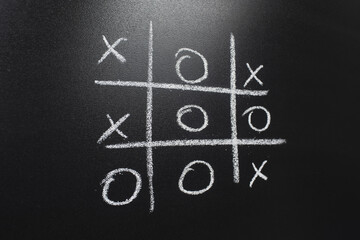 close up- Tic-Tac-Toe game (win)
on blackboard background - Powered by Adobe