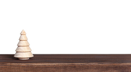 wooden Christmas tree on the table isolated on a white background