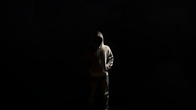 silhouette of a man surrounded by drakness