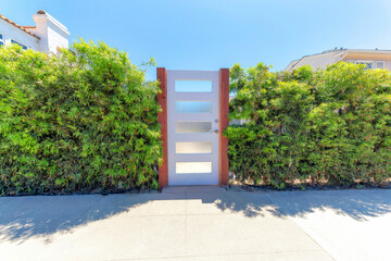 White gate door with glass panels at La Jolla, California