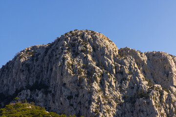a rocky mountain and blue sky