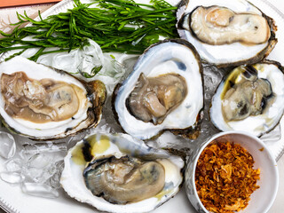 Thai fresh Oysters with ice on plate