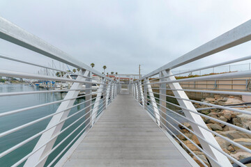Concrete pier with white metal railings at Oceanside, California