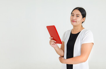Charming Asian woman hold tablet and looking for online internet info searching, business news check and communication. Comfortable mobile computer for casual working lifestyle