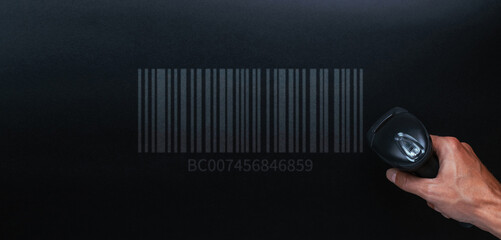 Barcode concept. Retail label barcode scan. Reader laser scanner for warehouse on black background. Warehouse inventory management.