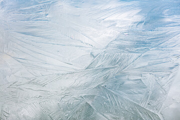 beautiful patterns on icy surface. frozen river winter background.
