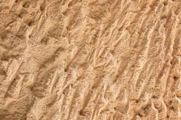 textured old soft tuff stone wall with abstract pattern, soft focus
