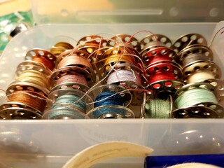 Multicolored spools of thread for seamstress