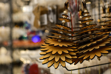 Wooden toys in the shape of a Christmas tree. Traditional Christmas market with souvenirs. Decor market. Christmas toys in the store. Shopping for the Christmas tree.