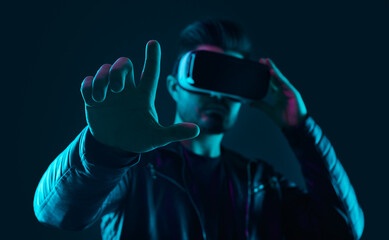 Futuristic man interacting with virtual reality