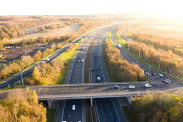 Aerial view of UK motorway and overbridge at sunset