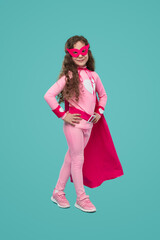 Cheerful girl in superhero costume