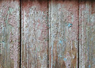 unusual background of worn old wooden boards with cracked paint, different tones and textures. background. copy space. artistic background, non-standard.