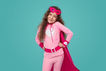 Charming superhero girl in pink costume