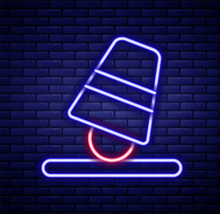 Glowing neon line Game thimbles icon isolated on brick wall background. Ball and glass. Chance and fortune concept. Colorful outline concept. Vector