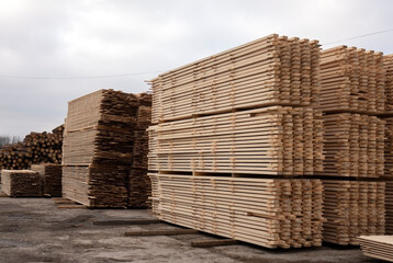 Lumber warehouse. Wooden boards in a stack