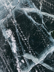 Lake Baikal ice texture. Cracks in the ice. Frozen Lake Baikal.