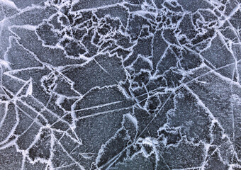 Lake Baikal ice texture. Cracks in the ice. Frozen Lake Baikal.