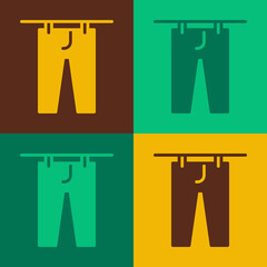 Pop art Drying clothes icon isolated on color background. Clean pants. Wash clothes on a rope with clothespins. Clothing care and tidiness. Vector
