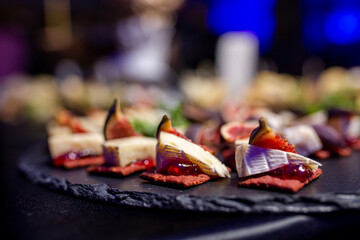 snack with soft cheese and figs close-up