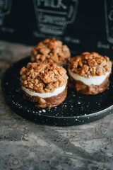 Apple crumble dessert on black plate