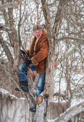 Hunter man at winter season at north, recreation, lifestyle of people, tourists take a haunting 