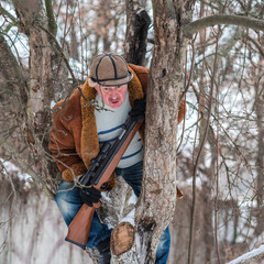 Hunter man at winter season at north, recreation, lifestyle of people, tourists take a haunting 