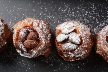 Baked apples with nuts and raisins. Homemade baked apples in the oven, with sugar powder close-up. Holiday dessert