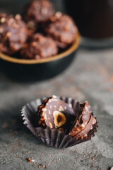 Handmade chocolate ferrero rocher in plate at dark background