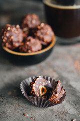 Handmade chocolate ferrero rocher in plate at dark background