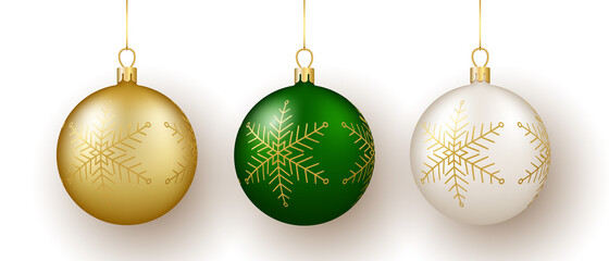 Christmas and New Year decor. Set of gold, white and green snowflake ornament balls on ribbon.