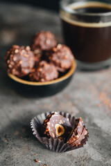 Handmade chocolate ferrero rocher in plate at dark background