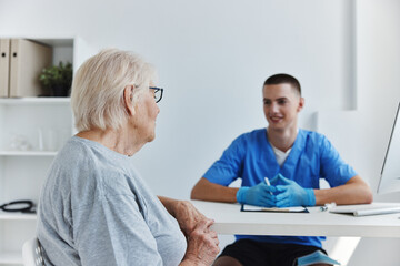 Fototapeta premium old woman talking to the doctor health and medicine