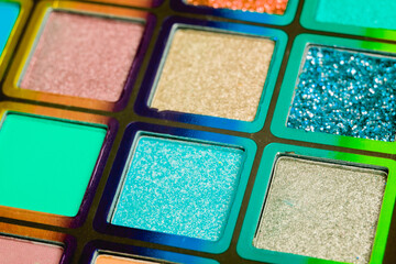 Flat lay of Broken bright multicolor eyeshadow as samples and swatches of cosmetic beauty product isolated on white background.