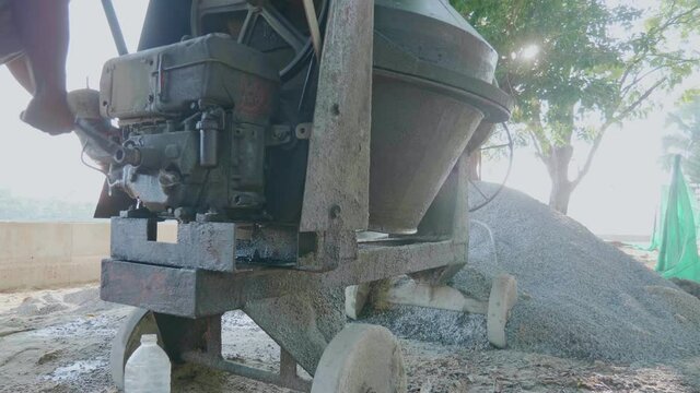 Small cement mixer. Mobile machinery for mixing mortar on the construction site