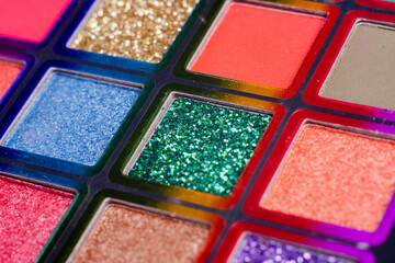 Flat lay of Broken bright multicolor eyeshadow as samples and swatches of cosmetic beauty product isolated on white background.