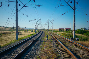 Fototapeta na wymiar Two railway tracks stretching beyond the horizon