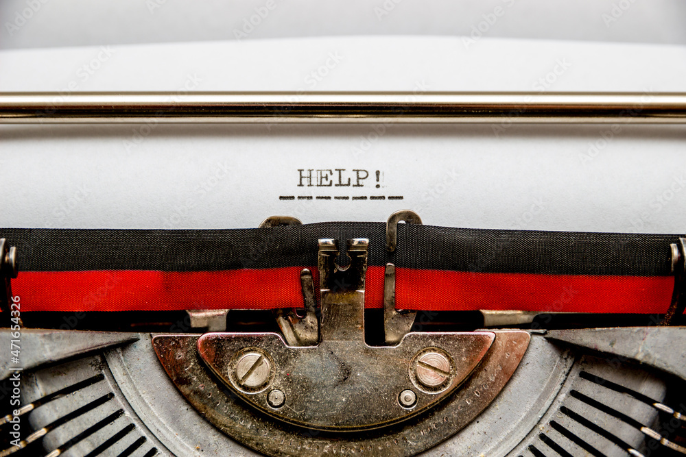 Fototapete call for help typed on an old typewriter. macro shot.