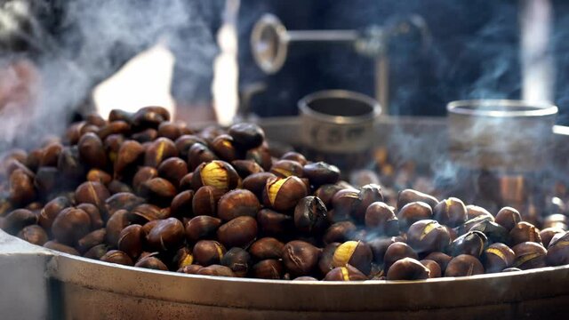 chestnuts cooked on the fire on the street in Milan - Typical winter snack of Lombard citizens