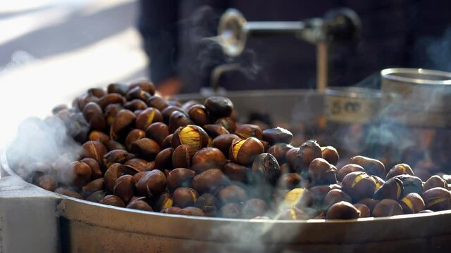 chestnuts cooked on the fire on the street in Milan - Typical winter snack of Lombard citizens