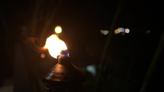 Flame torch is burning at night. Warm atmosphere