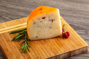 Hard cheese with dry tomato