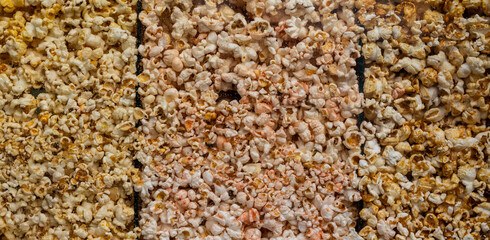 Popcorn background. Popcorn texture. Popcorn texture background. Hundreds popcorns background. High resolution, clean macro image.