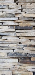 Wall of stone plates. Stone wall texture. Stone bricks. Stone wall background.