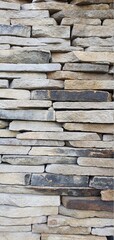 Wall of stone plates. Stone wall texture. Stone bricks. Stone wall background.